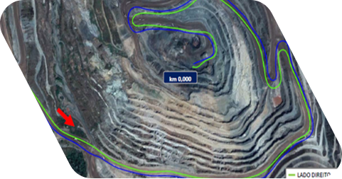 Imagem digital aérea que retrata os parâmetros estruturais, geométricos e funcionais das estradas de minas com sinalizações em azul e verde.
